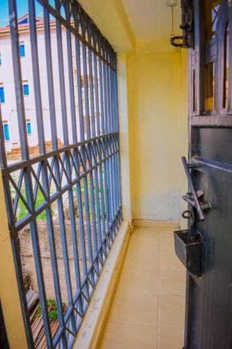 a room with a iron gate in a building at Modern one bedroom742333980 in Kisumu