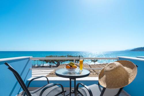 a table with a bowl of fruit on a balcony at BOGGI in Goúdhouros