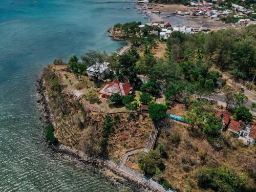 an aerial view of a house on an island in the water at GILI VIEW By Maza in Teluk Nara