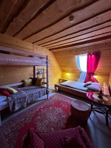 a bedroom with a bunk bed and a window at Rakši in Cēsis