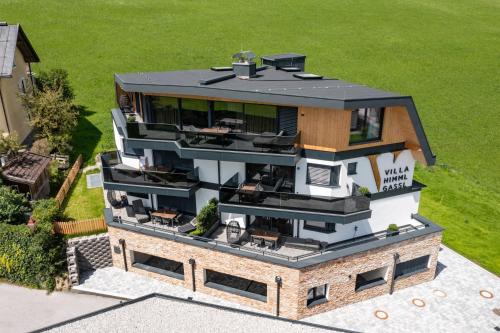 an aerial view of a house with a roof at Villa Himmlgassl Private Spa in Zellbergeben