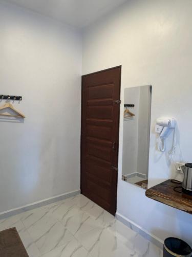 a room with a door and a counter with aounter at Guest House Gua Kelam in Kaki Bukit