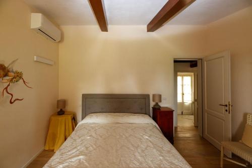 a bedroom with a bed in a room at Borgo Villa Risi in Siena