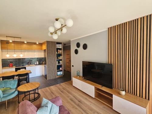 Faktura VAT Apartament przy Loftach u Scheiblera parking podziemny, Śniadaniownia