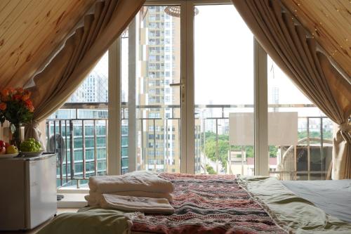 Säng eller sängar i ett rum på Kang's Home Cầu Giấy
