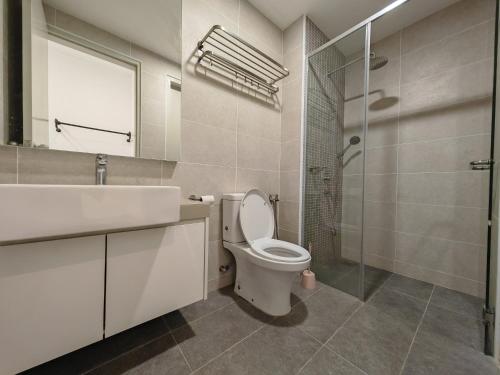 a bathroom with a toilet and a sink and a shower at Mykey Bali A-10-06 Melaka City in Melaka