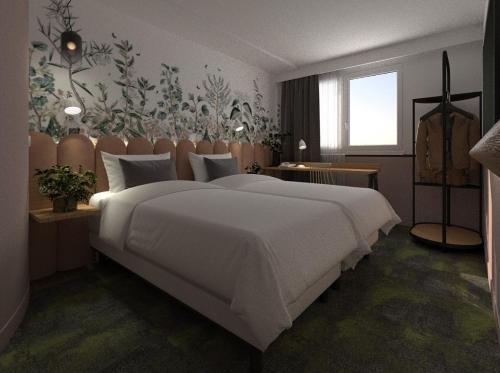 a bedroom with a large white bed in a room at Hôtel ibis Styles Pontivy centre Bretagne in Pontivy