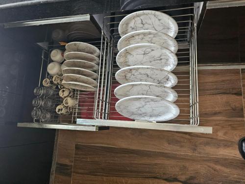 a rack full of uncooked breads and onions at 3 BHK in Krishna Nagar Lucknow LKO 202R in Lucknow