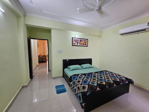 a bedroom with a bed in a room at 3 BHK in Krishna Nagar Lucknow LKO 202R in Lucknow