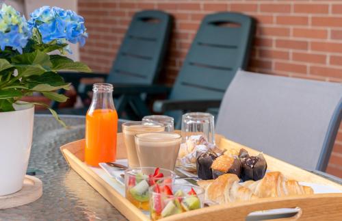 a tray of food on a table with drinks and snacks at La City Estación in Alicante