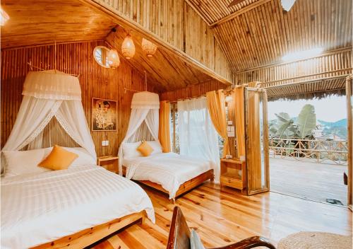 Ένα ή περισσότερα κρεβάτια σε δωμάτιο στο Nay Bungalow Dalat