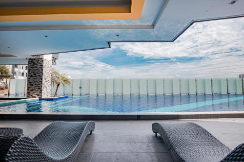 a view of a swimming pool from a building at Ipoh Majestic Premium Suites by Verve in Ipoh