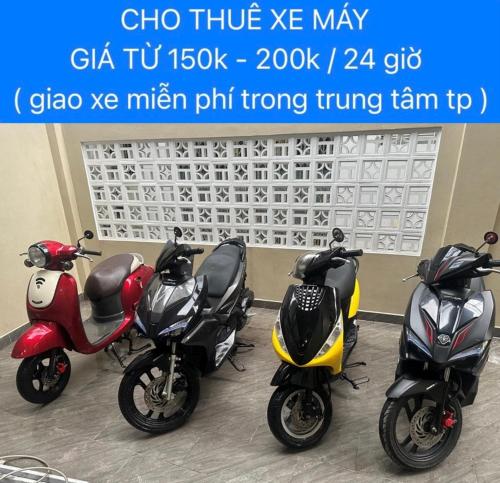 three scooters parked next to each other in a room at Halidao Homestay in Hai Phong