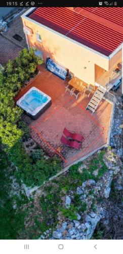 an overhead view of a house with a swimming pool at Apartments Marija in Bribir