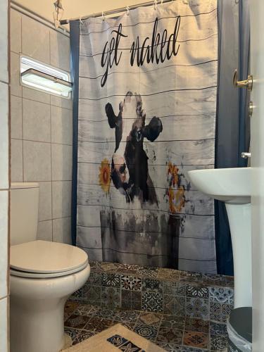 a bathroom with a shower curtain that says get married at PJ GARDEN HOUSE in Athens