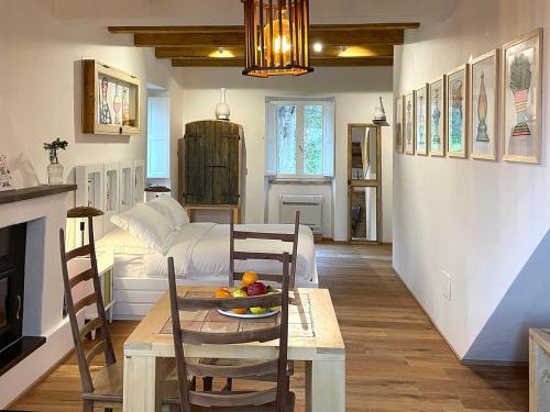 a living room with a table and a couch at Castello di Granarola Relais - Adults Friendly - in Gradara