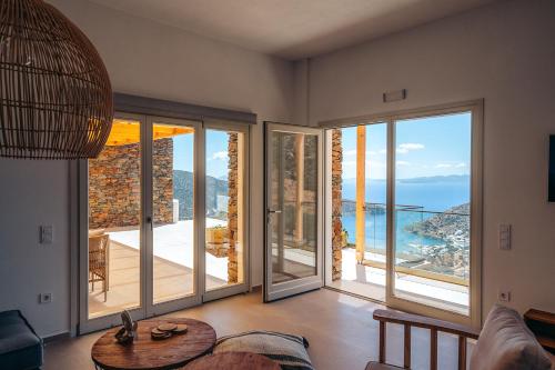 a living room with a view of the ocean at Melianthos Villas in Vathi, Sifnos