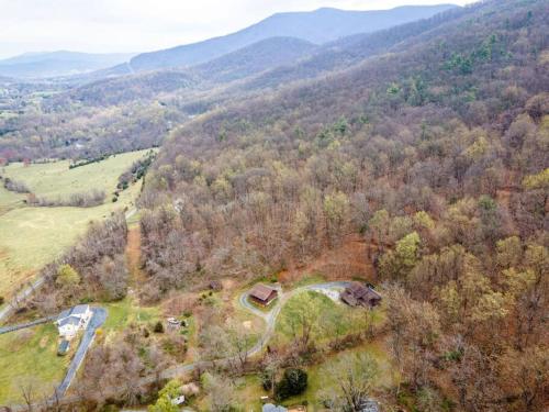 an aerial view of a hill with trees and a house at Mountain Views, Hot Tub, Firepit, dog friendly, EV connector in Stanley