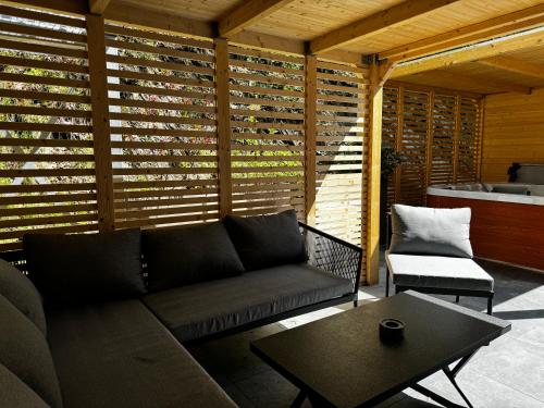 a living room with a couch and a table at Schlosshotel Brilon-Wald in Brilon-Wald