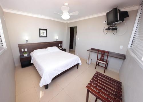 Un pat sau paturi într-o cameră la Lider Hotel Ituiutaba