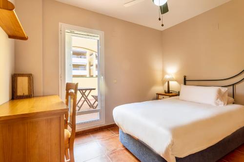 a bedroom with a bed and a window at Family house on the beach for holidays and temporary workers at Beach Sagunto Valencia in Sagunto