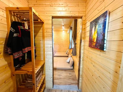 a sauna with a bunk bed in a wooden cabin at Tà Đùng May Farm in Biđong