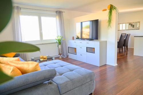 a living room with a couch and a table at Naturidyll am See in Fußach