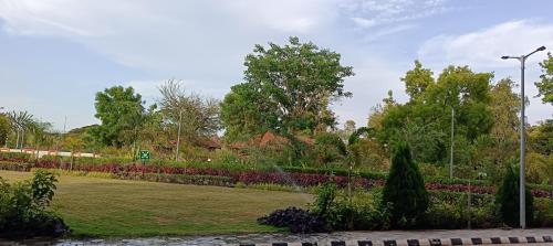 a park with flowers and a street light at Fortune Statue Of Unity, Ekta Nagar - Member ITC Hotels' Group in Kevadia