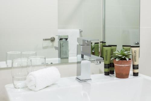 a bathroom counter with a sink and a mirror at Blissful Bream in Sydney