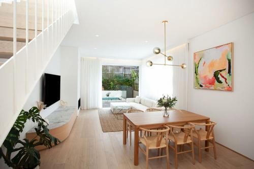 a living room with a table and a couch at Bondi Casa del Sol in Sydney