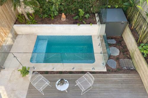 an overhead view of a swimming pool in a backyard at Bondi Casa del Sol in Sydney