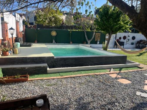 a swimming pool in the backyard of a house at Casa kintsugi in Masquefa