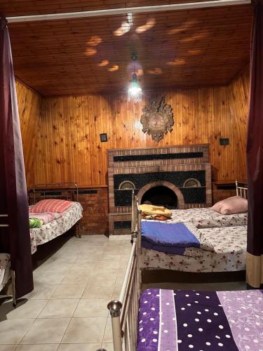 Postel nebo postele na pokoji v ubytování Guest House Iura