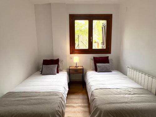 Postel nebo postele na pokoji v ubytování Alquiler de Temporada en La Bastida de Sort - L'Amfitriona