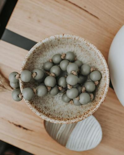 a bowl filled with balls on top of a table at Tranmere Seaside Serenity in Tranmere