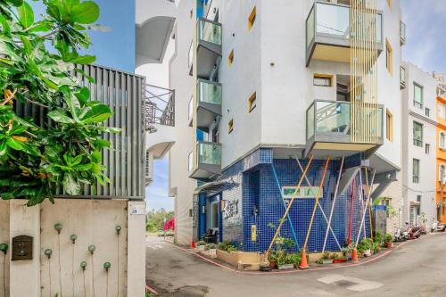 an apartment building with a blue and white facade at Pacific Inn in Kenting