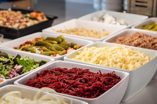 a buffet of different types of food in trays at ALEGRIA Colonial Mar Aquafun in Roquetas de Mar