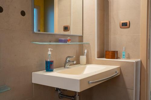 a bathroom with a sink and a mirror at La Casa di Potty in Rapallo