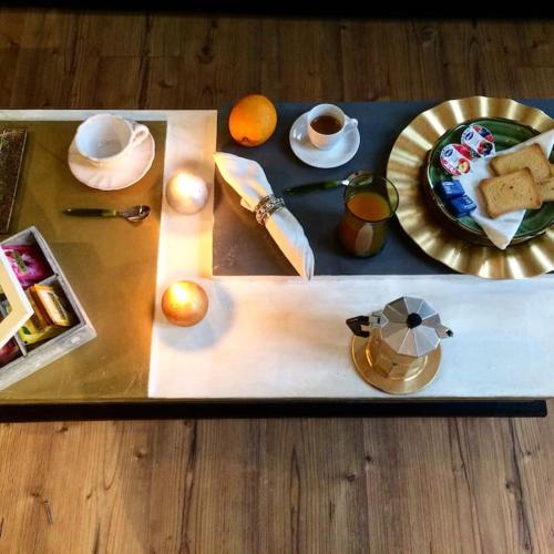 a tray with a plate of food on a table at Jill&Jade's Apartment in Como
