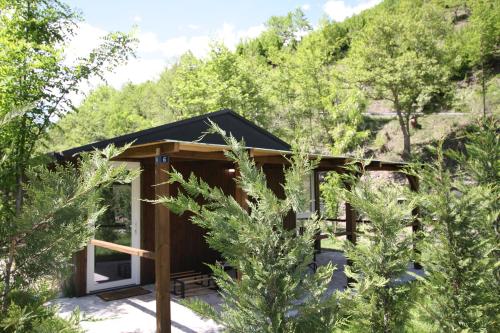 a cabin in the woods with trees at Lugina e Shengjergjit ,Bujtinat in Tirana