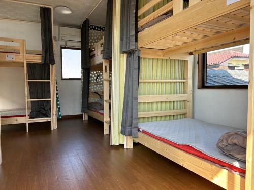 a bedroom with bunk beds in a house at Kinoie guesthouse 3rd buildingーVacation STAY 26705v in Mito