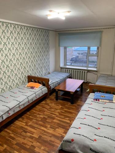 Ένα ή περισσότερα κρεβάτια σε δωμάτιο στο Gan Oyu Guest house