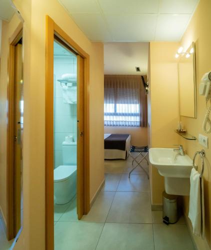 a bathroom with a sink and a toilet at La City Mercado in Alicante