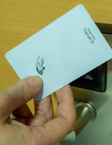 a person holding a piece of paper in a printer at La City Mercado in Alicante