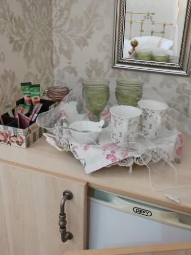 a counter with bowls and other items on it at A La Maison Boutique Guesthouse in Parys