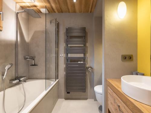 a bathroom with a shower and a toilet and a sink at Appartement La Clusaz, 4 pièces, 8 personnes - FR-1-304-176 in La Clusaz