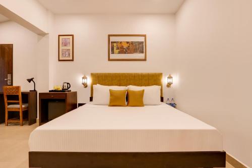 Voodi või voodid majutusasutuse Lemon Tree Hotel, Dapoli toas