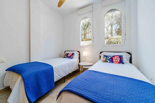 Кровать или кровати в номере Salonica Beach Duplex III Javea Arenal by Rock Rentals
