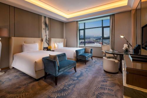 Katil atau katil-katil dalam bilik di Hilton Urumqi