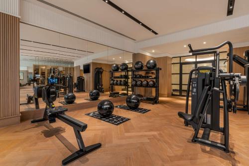 a gym with several treadmills and exercise bikes at Waldorf Astoria Cairo Heliopolis in Cairo
